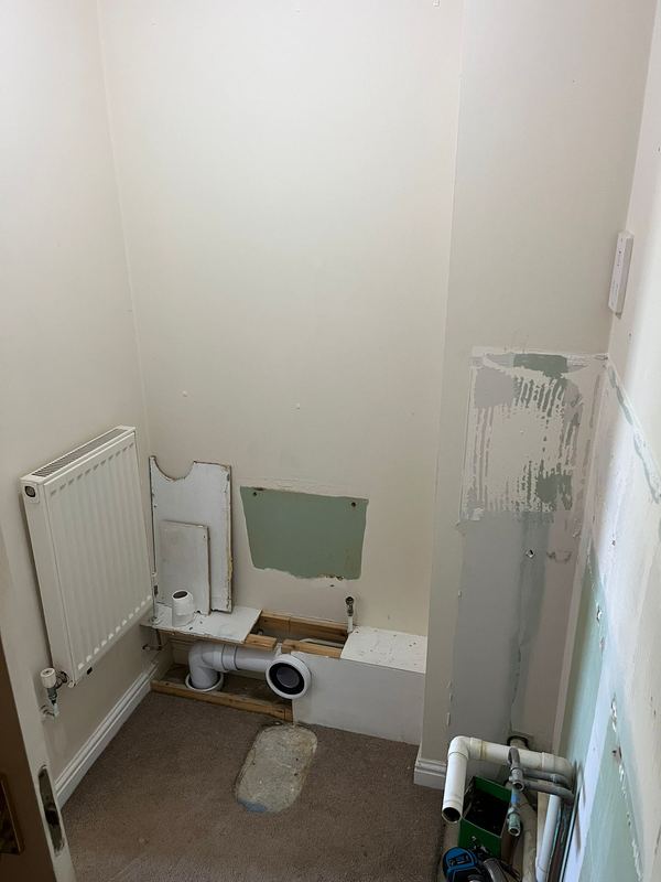 The space stripped back, ready for a new shower.